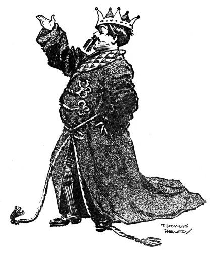 William wearing his father's dressing-gown and a tinsel crown.